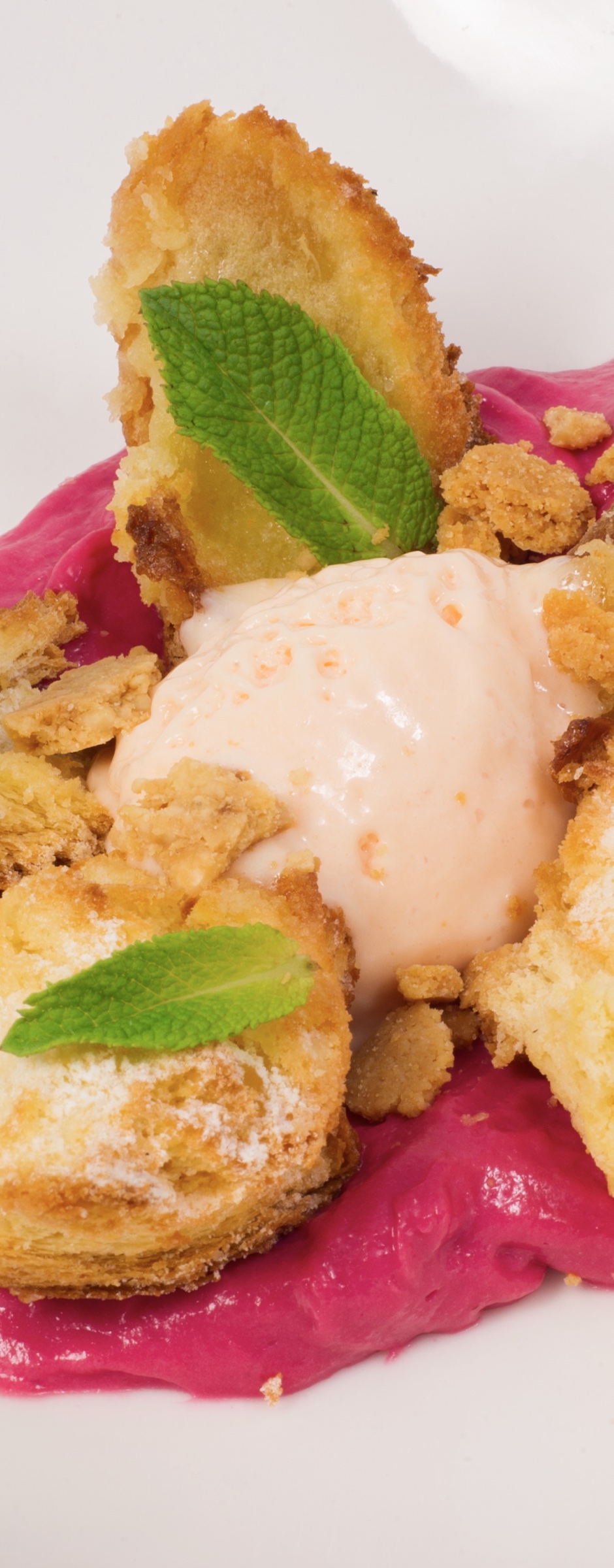Berry dessert with mint, crumble and ice cream